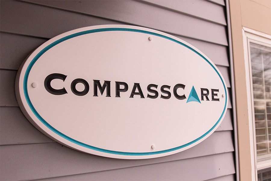 A sign for the pro-life pregnancy center CompassCare is displayed