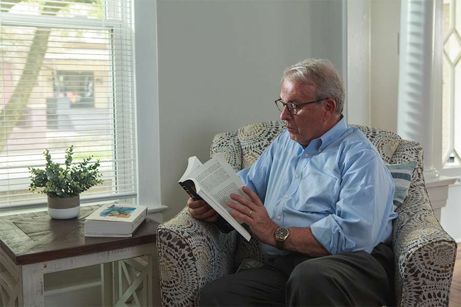 Dr. Allan Josephson is seen reading a book.